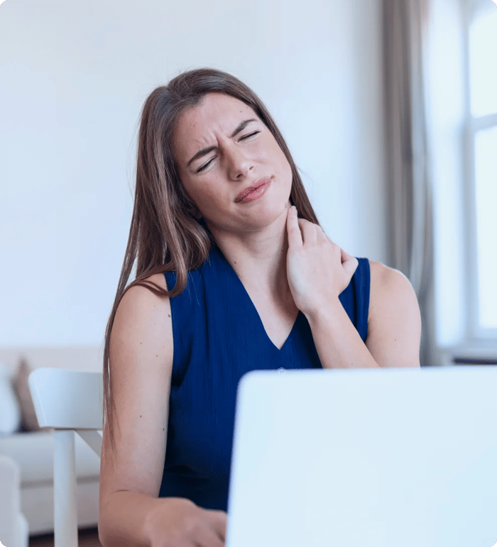 Woman rubbing her stiff neck days after a rear-end collision