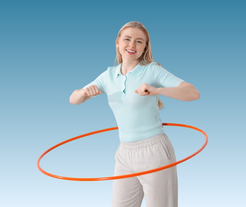 Woman clutching her hip with both hands, looking down in discomfort.