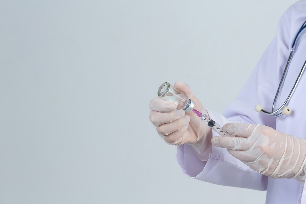 Doctor preparing injectable therapy for regenerative wellness treatment